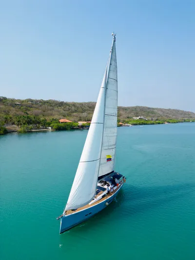  Yacht Photos Pics 2014 Hanse 575 sailboat cruising on turquoise waters.