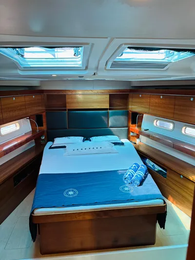  Yacht Photos Pics Luxurious cabin interior of a 2014 Hanse 575 yacht with skylights and wooden finishes.