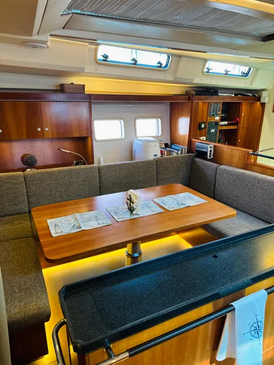  Yacht Photos Pics Interior of 2014 Hanse 575 yacht with dining area and modern amenities.