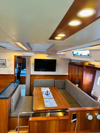  Yacht Photos Pics Interior of 2014 Hanse 575 yacht with cozy dining area and modern amenities.