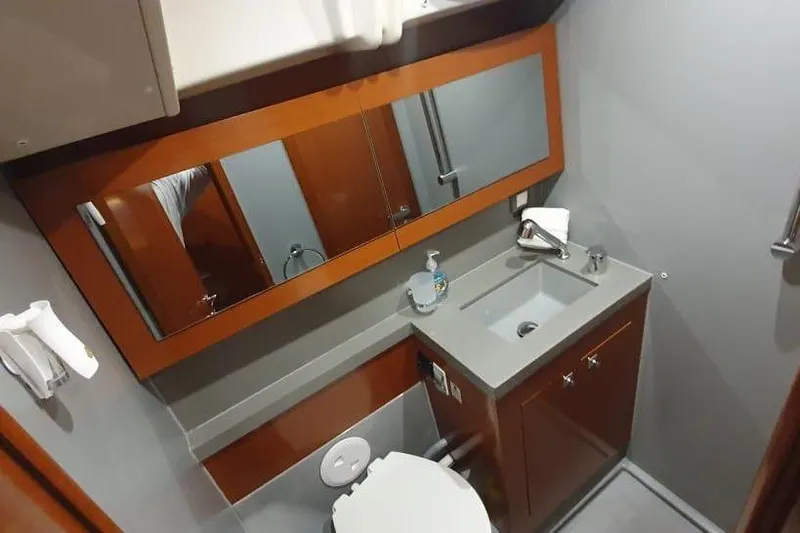 Mareo Yacht Photos Pics Bathroom interior of 2018 Beneteau Oceanis 55.1 yacht with modern fixtures.