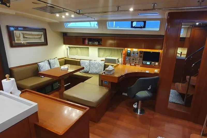 Mareo Yacht Photos Pics Luxurious interior of 2018 Beneteau Oceanis 55.1 yacht with elegant seating and navigation area.