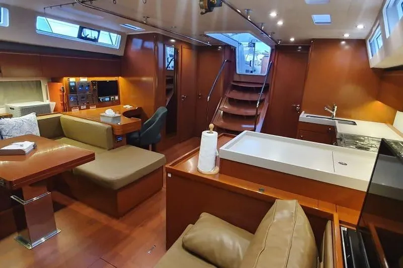 Mareo Yacht Photos Pics Luxurious interior of 2018 Beneteau Oceanis 55.1 yacht with modern amenities and wooden finishes.