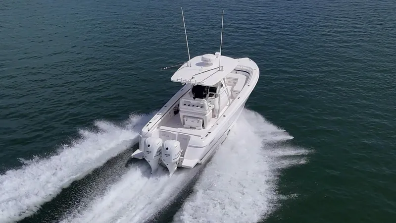 Christyl Clear Yacht Photos Pics 2018 Intrepid 327 Center Console boat cruising on open water.