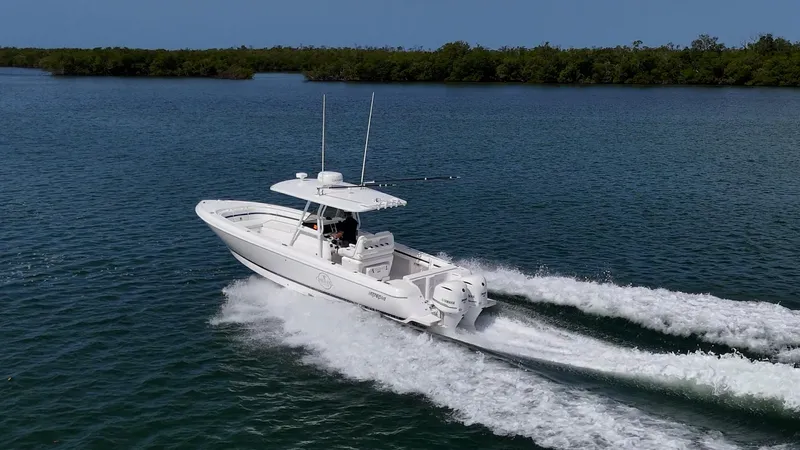 Christyl Clear Yacht Photos Pics 2018 Intrepid 327 Center Console boat cruising on open water.