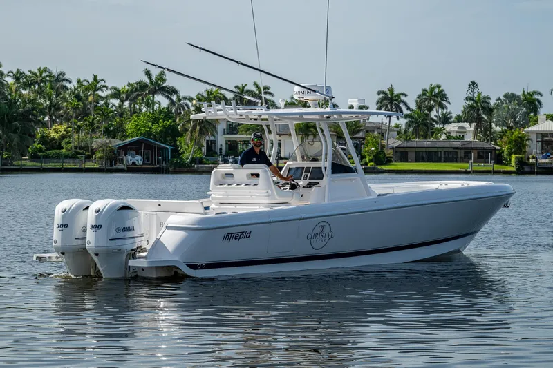 Christyl Clear Yacht Photos Pics 2018 Intrepid 327 Center Console boat on calm water, featuring twin Yamaha 300 engines.