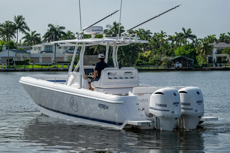 Christyl Clear Yacht Photos Pics 2018 Intrepid 327 Center Console boat with twin Yamaha engines on a calm waterway.
