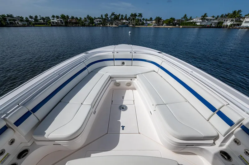 Christyl Clear Yacht Photos Pics 2018 Intrepid 327 Center Console boat with spacious seating on calm water.