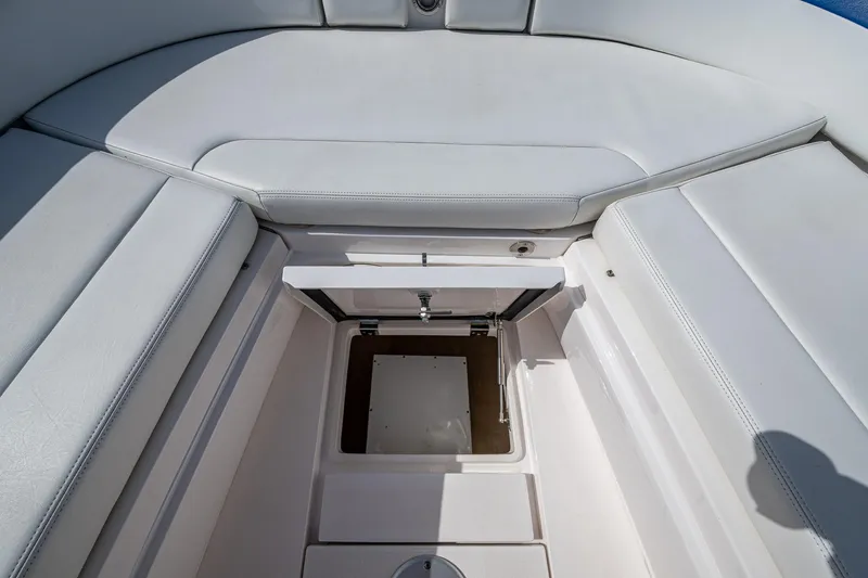 Christyl Clear Yacht Photos Pics 2018 Intrepid 327 Center Console boat storage compartment with cushioned seating.