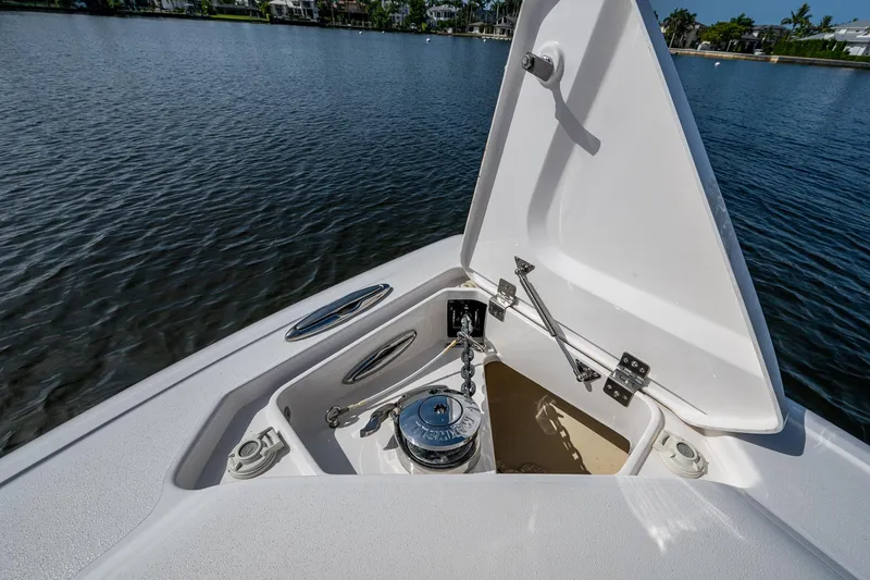 Christyl Clear Yacht Photos Pics 2018 Intrepid 327 Center Console anchor compartment open on calm water.