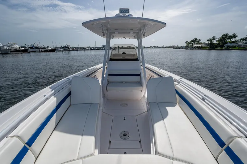 Christyl Clear Yacht Photos Pics 2018 Intrepid 327 Center Console boat on calm water, featuring spacious seating and sleek design.