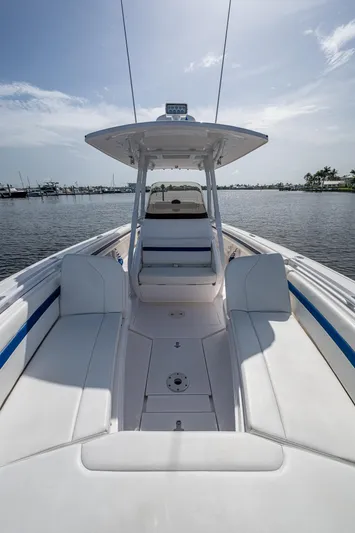 Christyl Clear Yacht Photos Pics 2018 Intrepid 327 Center Console boat on calm water, showcasing spacious seating and sleek design.