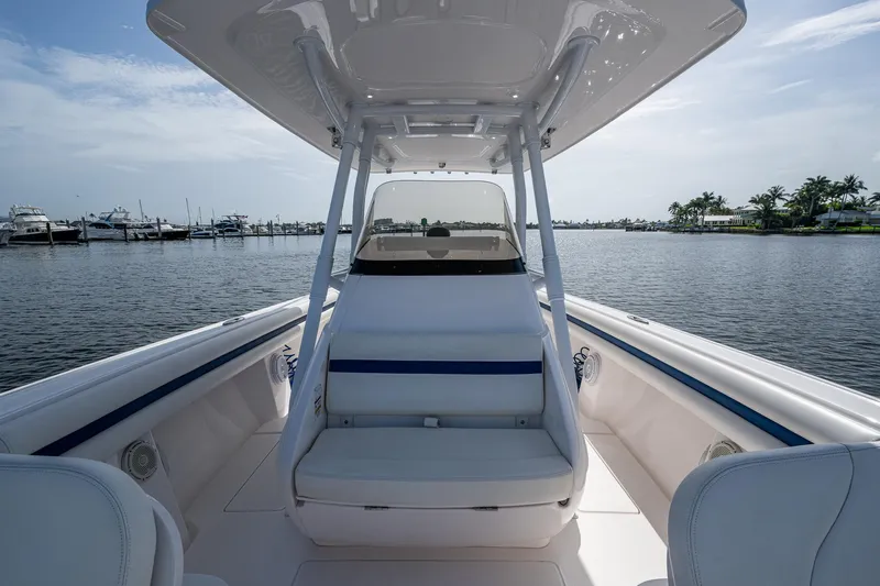 Christyl Clear Yacht Photos Pics 2018 Intrepid 327 Center Console boat on calm water, featuring sleek design and spacious seating.