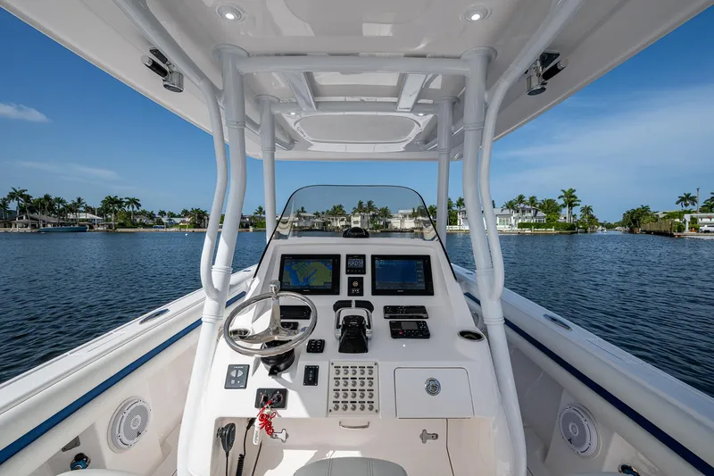 Christyl Clear Yacht Photos Pics 2018 Intrepid 327 Center Console boat dashboard with navigation screens on a sunny day.