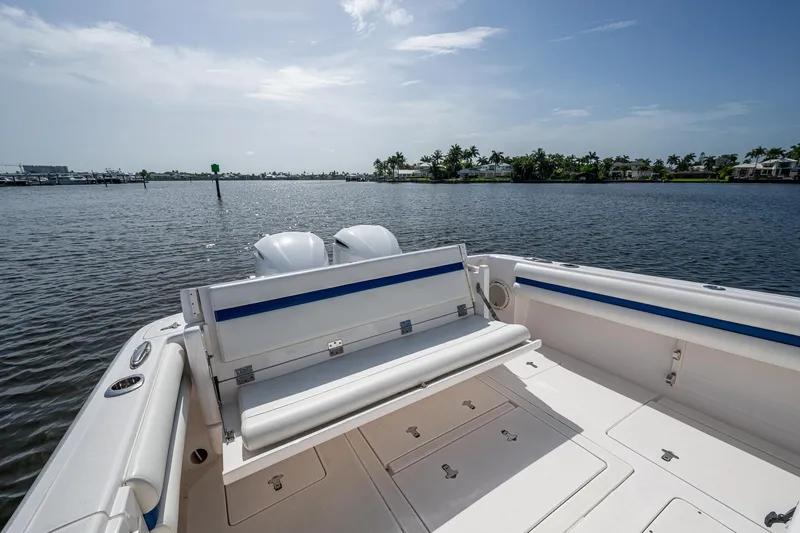 Christyl Clear Yacht Photos Pics 2018 Intrepid 327 Center Console boat on calm water, featuring spacious seating and storage.