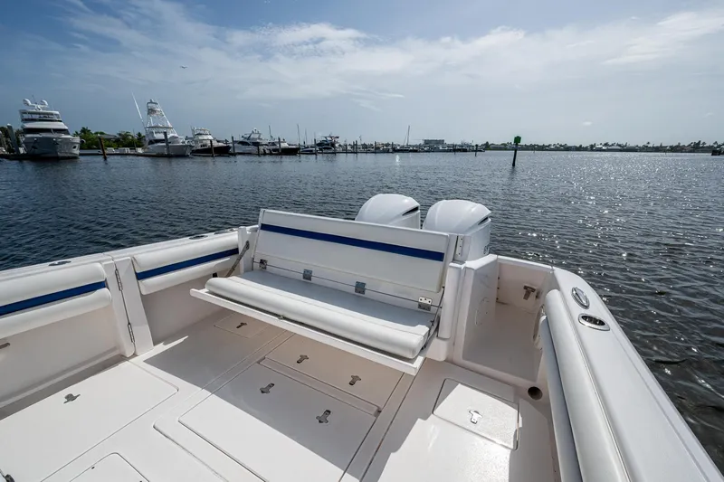 Christyl Clear Yacht Photos Pics 2018 Intrepid 327 Center Console boat with open deck, docked in a marina.