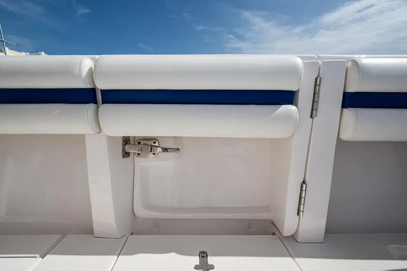 Christyl Clear Yacht Photos Pics 2018 Intrepid 327 Center Console boat interior with white and blue cushioned seating.
