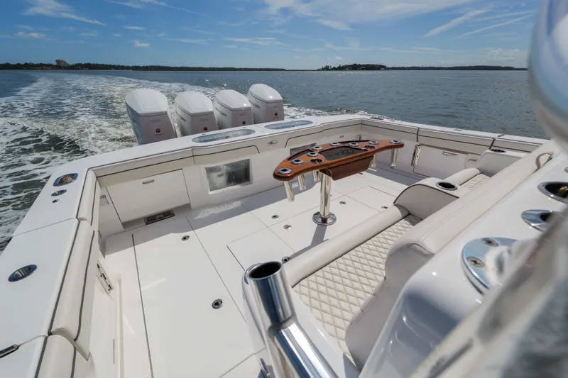 Lucky 24 IV Yacht Photos Pics 2024 Valhalla Boatworks V-55, luxurious deck with quad engines, cruising on open water.