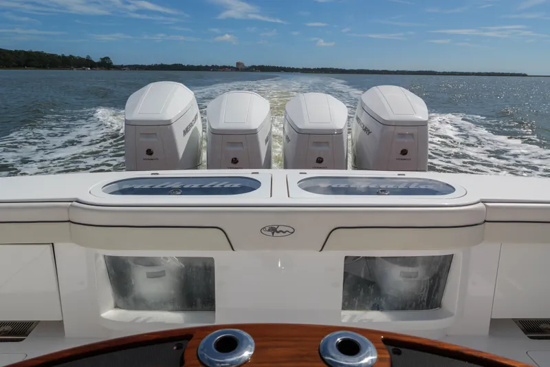 Lucky 24 IV Yacht Photos Pics 2024 Valhalla V-55 boat with four Mercury engines cruising on open water.