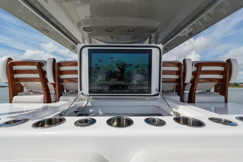 Lucky 24 IV Yacht Photos Pics 2024 Valhalla Boatworks V-55 interior with seating and entertainment screen.