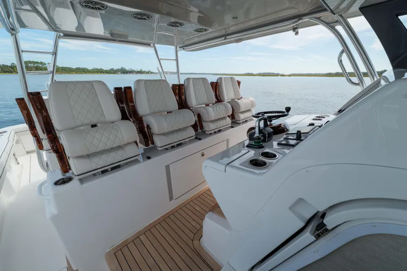 Lucky 24 IV Yacht Photos Pics 2024 Valhalla Boatworks V-55 interior with luxurious seating and modern helm controls.