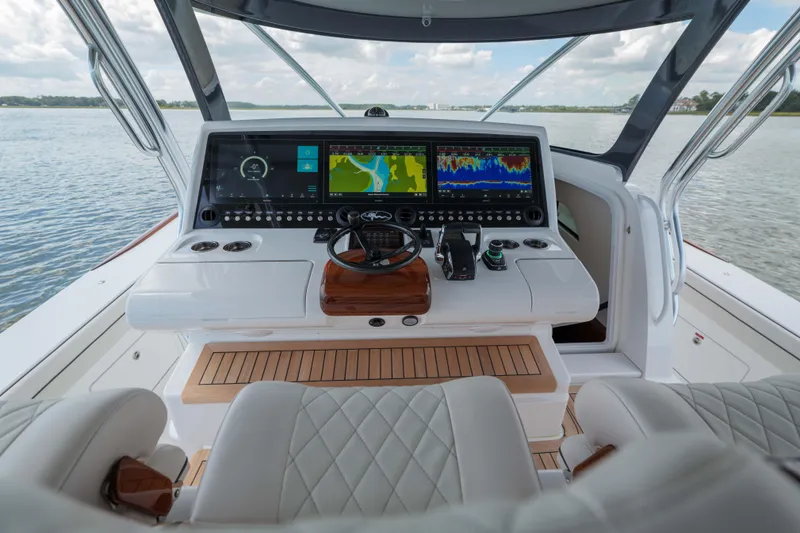 Lucky 24 IV Yacht Photos Pics 2024 Valhalla Boatworks V-55 helm with advanced navigation displays and luxurious seating.