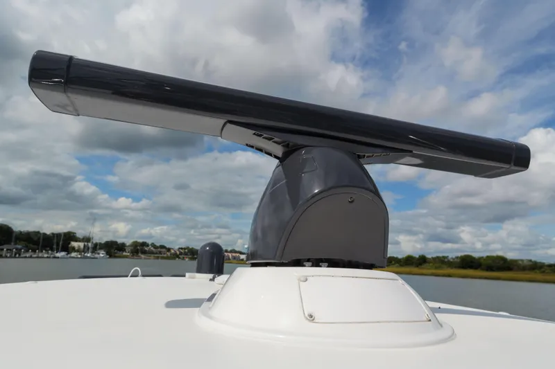 Lucky 24 IV Yacht Photos Pics 2024 Valhalla Boatworks V-55 radar system against a cloudy sky backdrop.
