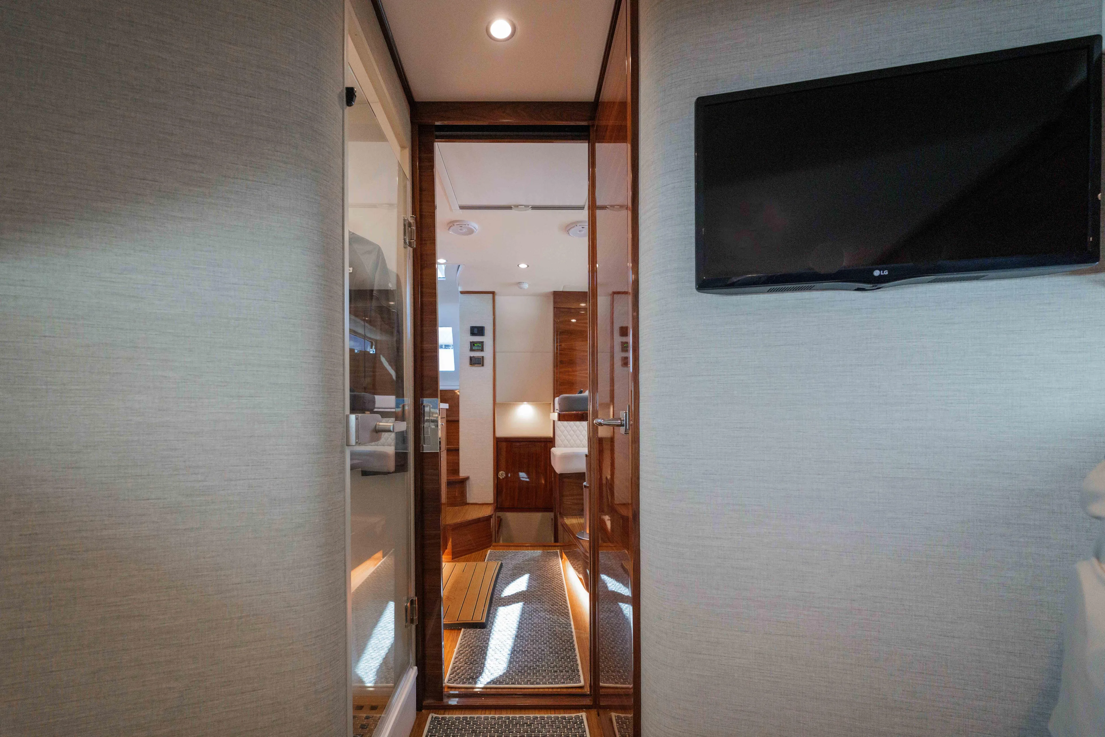 Lucky 24 IV Yacht Photos Pics Interior view of 2024 Valhalla Boatworks V-55, featuring modern design and wood accents.