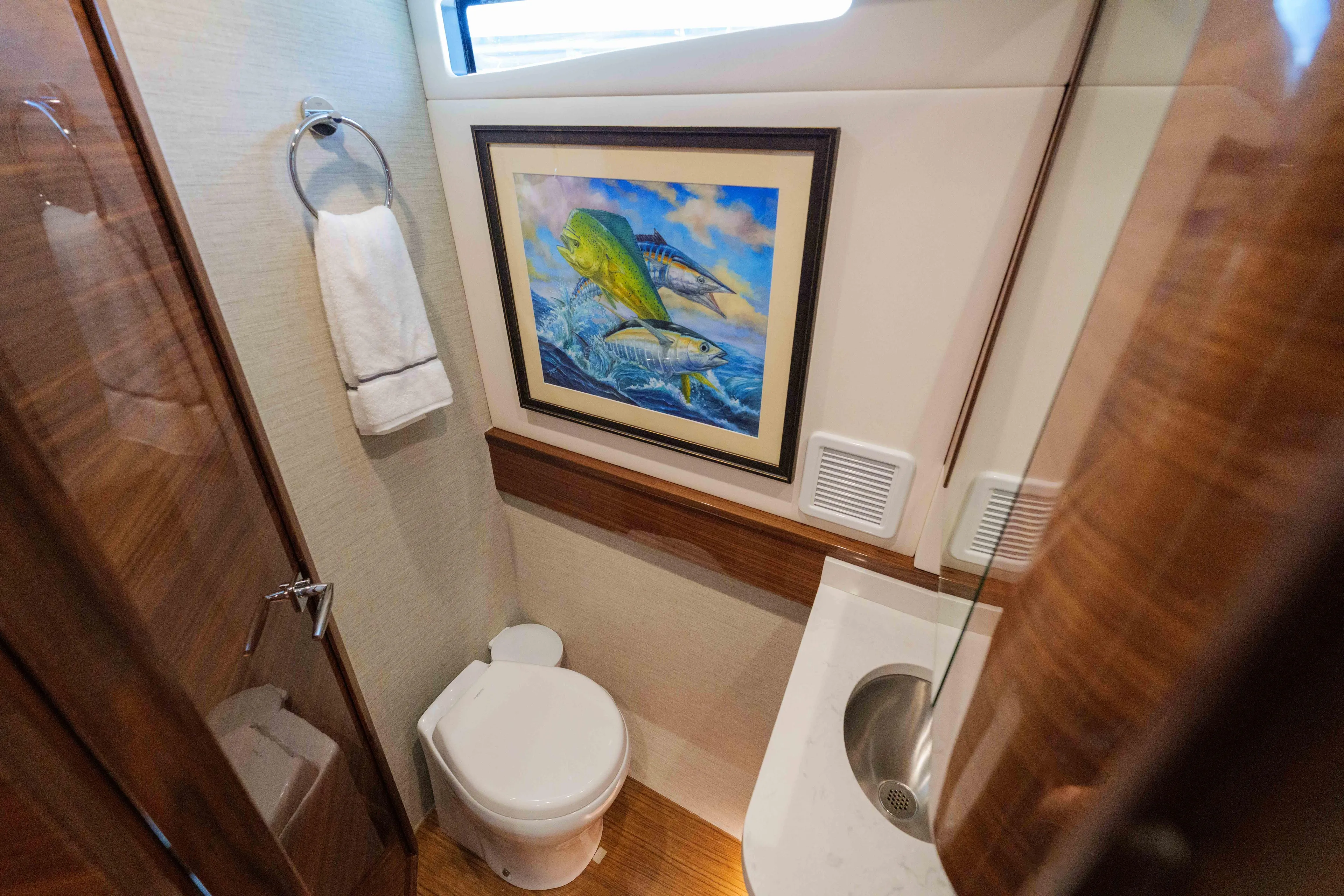 Lucky 24 IV Yacht Photos Pics Luxurious 2024 Valhalla V-55 boat bathroom with artwork and modern amenities.