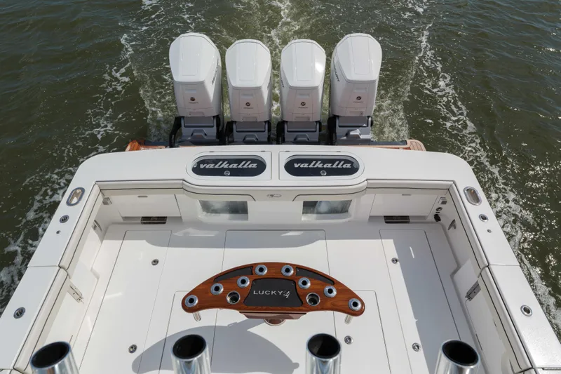 Lucky 24 IV Yacht Photos Pics 2024 Valhalla Boatworks V-55 with quad engines, cruising on open water.