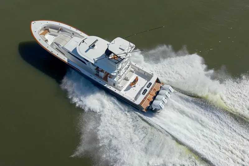 Lucky 24 IV Yacht Photos Pics 2024 Valhalla Boatworks V-55 cruising on water, aerial view.