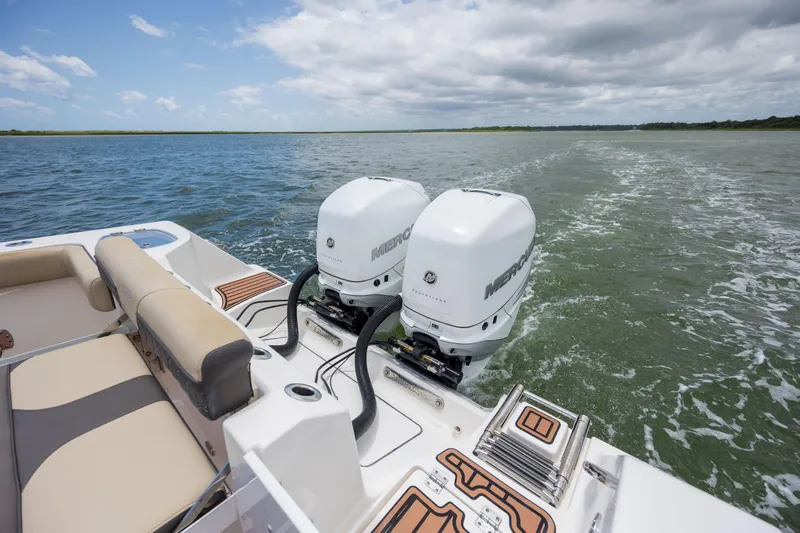  Yacht Photos Pics 2020 Tidewater 320 CC Adventure boat with dual Mercury outboard engines on open water.
