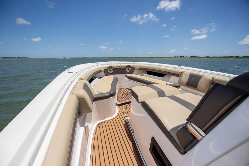  Yacht Photos Pics 2020 Tidewater 320 CC Adventure boat interior with luxurious seating on open water.