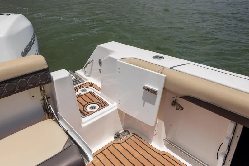  Yacht Photos Pics 2020 Tidewater 320 CC Adventure boat deck with seating and water view.