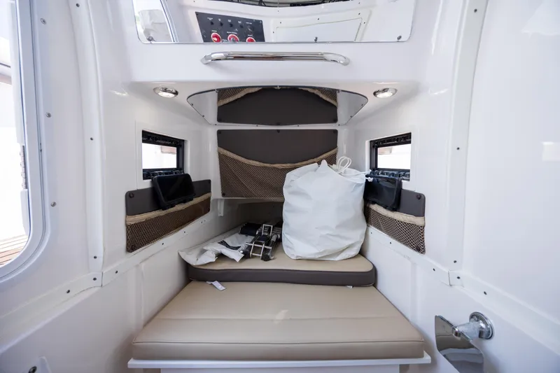  Yacht Photos Pics Interior cabin of 2020 Tidewater 320 CC Adventure boat, featuring seating and storage.