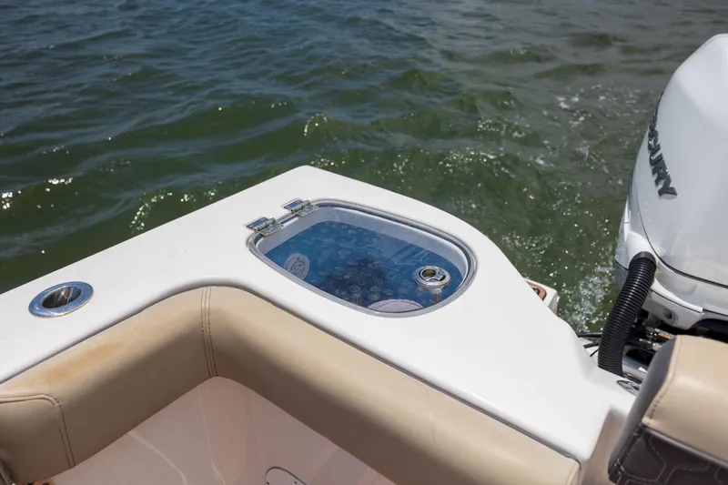  Yacht Photos Pics 2020 Tidewater 320 CC Adventure boat with livewell and Mercury engine on water.