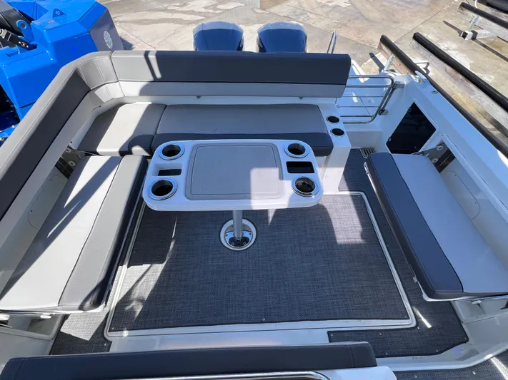  Yacht Photos Pics 2021 Jeanneau Leader 9.0 WA boat interior with seating and table.