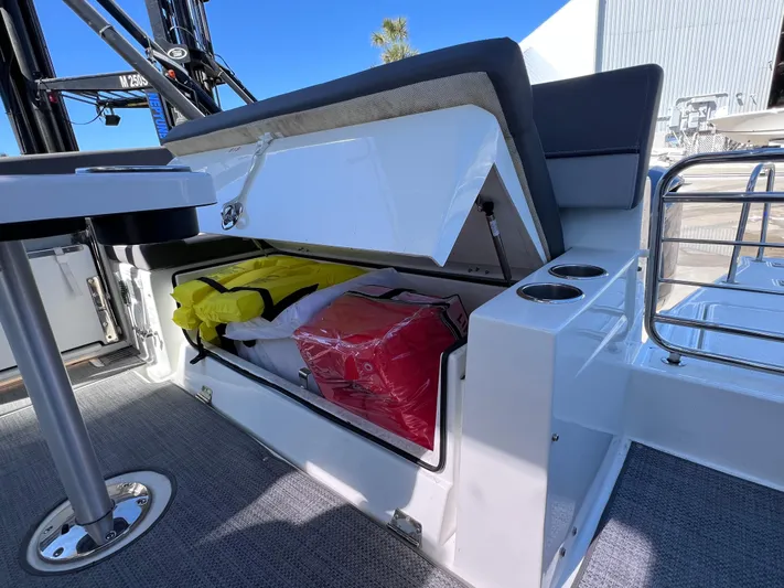  Yacht Photos Pics 2021 Jeanneau Leader 9.0 WA boat storage compartment with life jackets and accessories.