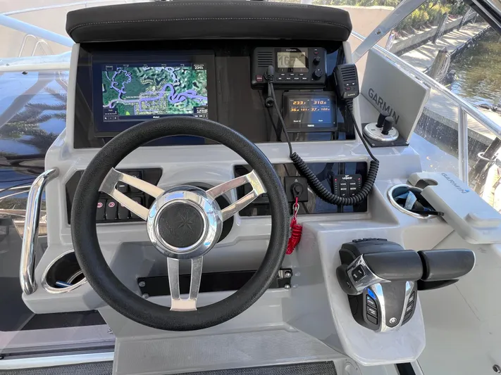  Yacht Photos Pics 2021 Jeanneau Leader 9.0 WA helm with Garmin navigation and Yamaha controls.