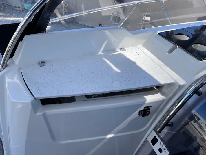  Yacht Photos Pics 2021 Jeanneau Leader 9.0 WA boat interior with sleek countertop and control panel.