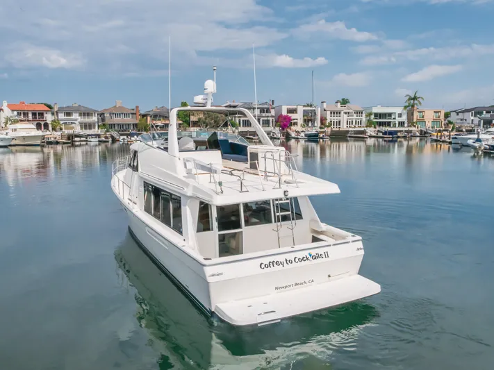 Coffey To Cocktails II Yacht Photos Pics 1998 Bayliner 4788 Pilot House Motoryacht docked in scenic marina.