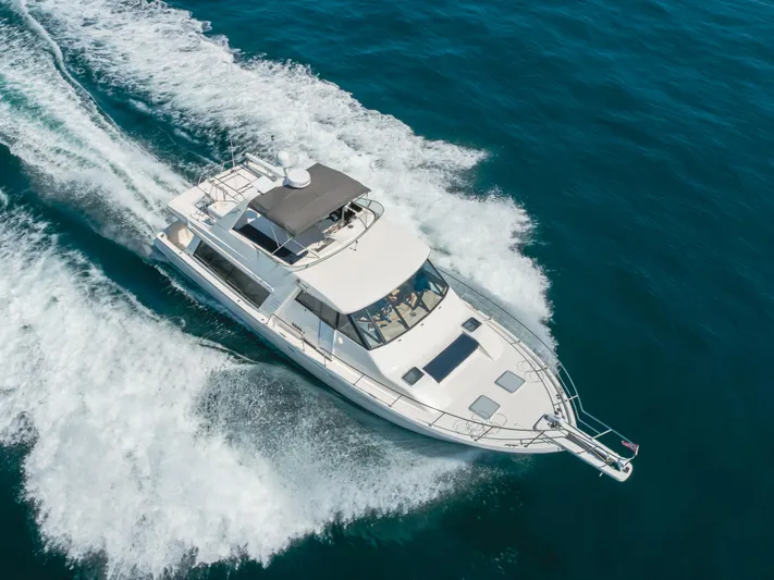 Coffey To Cocktails II Yacht Photos Pics 1998 Bayliner 4788 Pilot House Motoryacht cruising on open water.