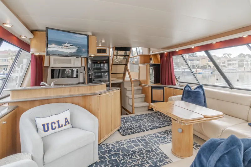 Coffey To Cocktails II Yacht Photos Pics Luxurious interior of 1998 Bayliner 4788 Pilot House Motoryacht with modern amenities and stylish decor.