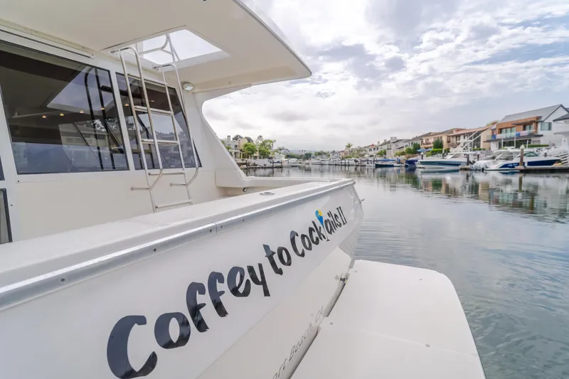 Coffey To Cocktails II Yacht Photos Pics 1998 Bayliner 4788 Pilot House Motoryacht docked in a scenic marina.