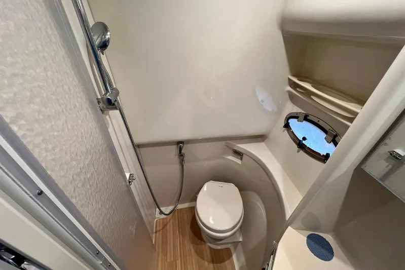 No Worries Yacht Photos Pics Bathroom interior of 2011 Formula 37 Performance Cruiser with shower and porthole window.