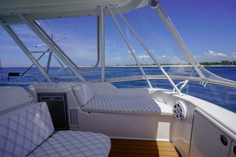 The Callback Yacht Photos Pics Luxurious 2007 Riviera 42 Flybridge interior with ocean view and comfortable seating.