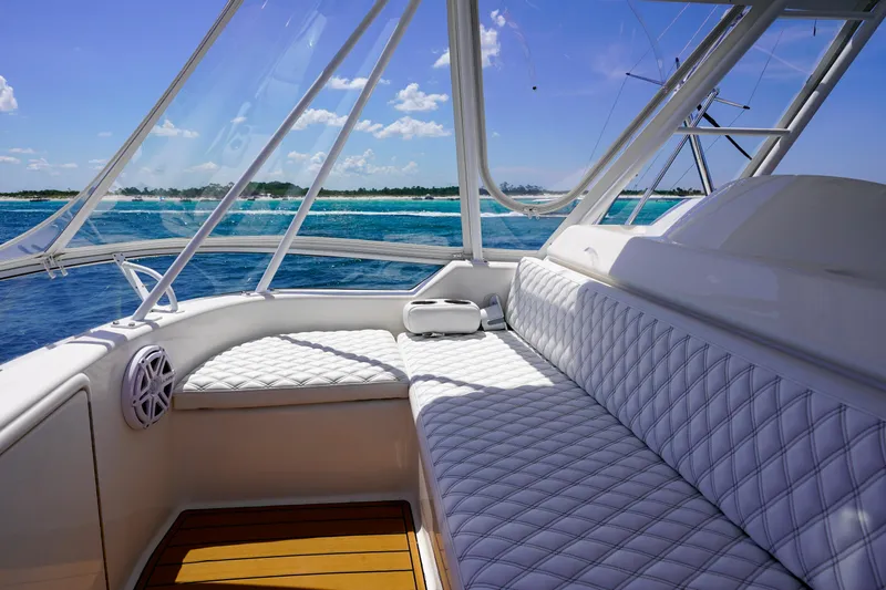 The Callback Yacht Photos Pics Luxurious 2007 Riviera 42 Flybridge yacht interior with ocean view and plush seating.