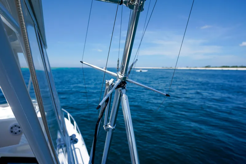 The Callback Yacht Photos Pics Riviera 42 Flybridge yacht on open sea, showcasing sleek design and clear blue waters.