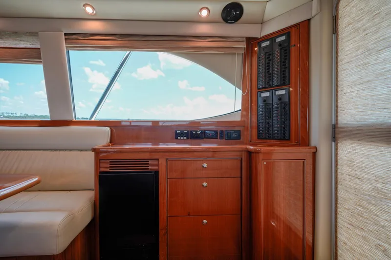 The Callback Yacht Photos Pics Interior of 2007 Riviera 42 Flybridge yacht with wood cabinetry and control panels.