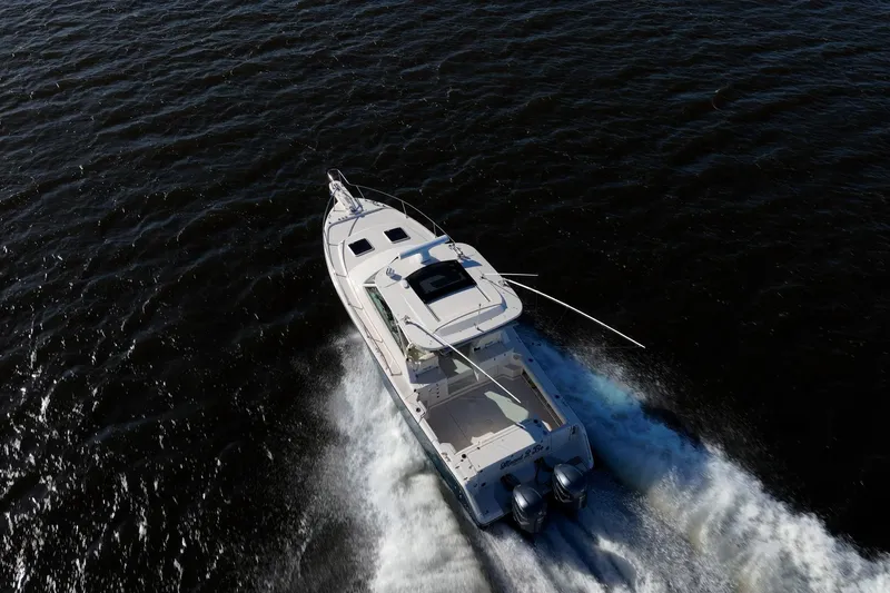 Meant To Be Yacht Photos Pics 2018 Grady-White Express 330 boat cruising on open water, aerial view.